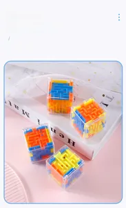 Detail view of 3D cube maze toys with colorful tracks on a decorative pink background