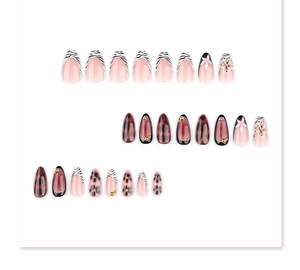 Detail of 3D flower and zebra print press-on nails with amber texture in coffin shape