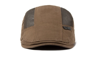Close-up of brown herringbone fabric and breathable mesh splicing on the flat cap