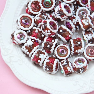 Macro detail of hand-painted gingerbread style beads for DIY jewelry and phone charms