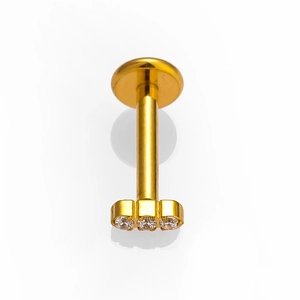 Macro detail of G23 titanium labret stud featuring three sparkling clear zircon crystals