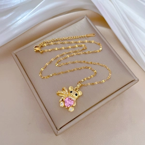 Luxurious gold bear necklace with pink heart gem and crystal paving on silk