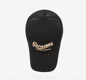 Close-up of golden 3D embroidery and breathable black mesh on this summer baseball cap