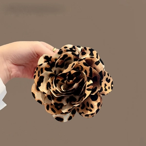3D leopard print floral hair claw with textured fabric petals and velvet finish