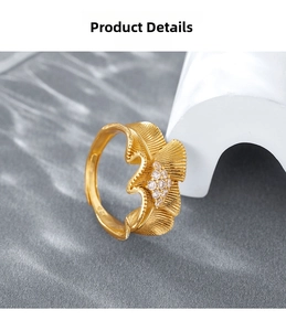 Detail of 925 sterling silver gold ring featuring pleated satin edge and small diamonds