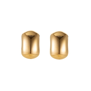 Macro view of gold geometric stainless steel stud earrings with a polished surface