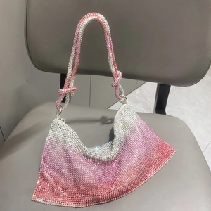 Detail of pink gradient rhinestone hobo bag showing knotted handle and crystal texture