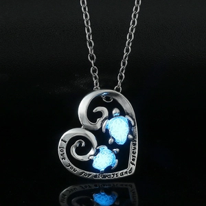 Luminous heart turtle necklace with I love you forever engraving in dark view