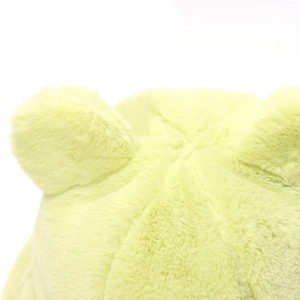 Close-up of fluffy light green teddy bucket hat with cute round ears and soft faux fur texture