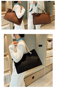 Close-up of large canvas tote bags with rope handles in black and brown styles