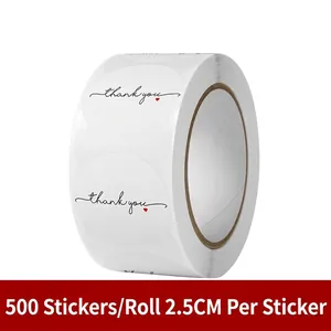 Detail of 2.5cm round white thank you stickers roll with red heart for gift sealing