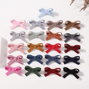 Set of 21 colorful handmade fabric bow hair clips for girls in various vibrant colors