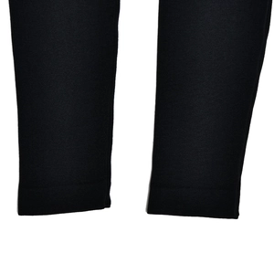 Detail shot of the black long sleeve bodysuit showing knit fabric texture and leg hem