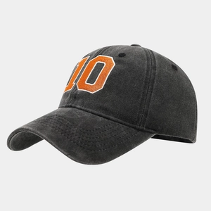 Vintage washed black baseball cap with orange number 10 embroidery and curved brim