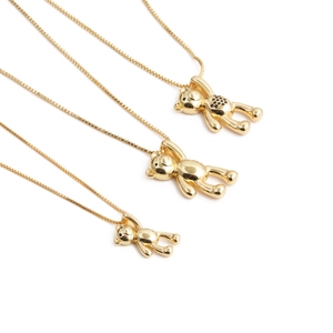 Golden bear pendant necklaces in three sizes with black cubic zirconia accents