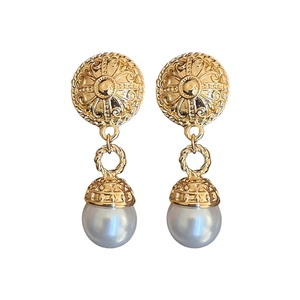 Vintage gold baroque earrings with textured metal round tops and faux pearl drops