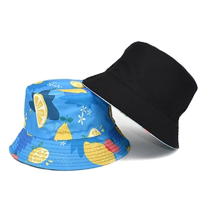 Reversible lemon print sun hat in blue and classic black cotton canvas for summer
