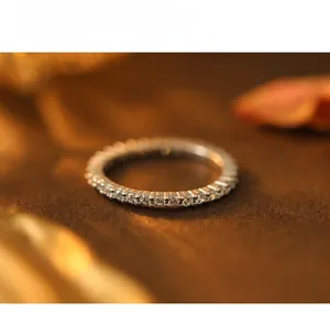 Macro shot of S925 sterling silver full diamond pave eternity ring with fine circular gems