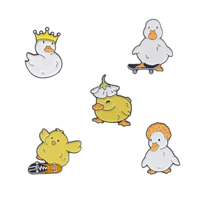 Cute enamel duck pins set featuring white and yellow ducks on skateboards and crowns