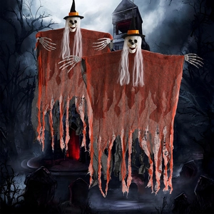 Close-up of hanging Halloween skeleton ghosts with black witch hats and tattered cloth