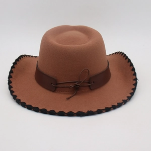 Top view of brown felt cowboy hat with stitched brim and leather decorative band