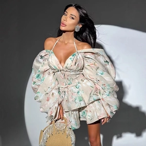 Floral halter mini dress with puff sleeves and layered ruffle hem in beige and pink