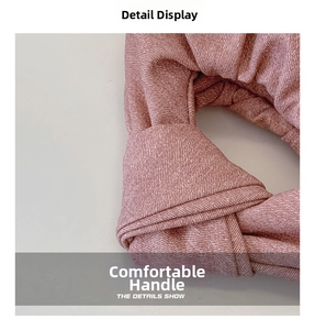 Detailed close-up of pink denim dumpling bag featuring a soft knotted handle design