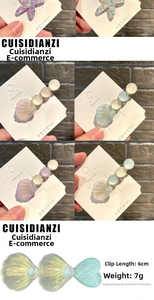 Macro detail of ice-translucent shell and starfish hair clips with glitter texture