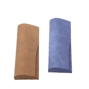 Minimalist nubuck texture eyewear cases in brown and blue colors on white background