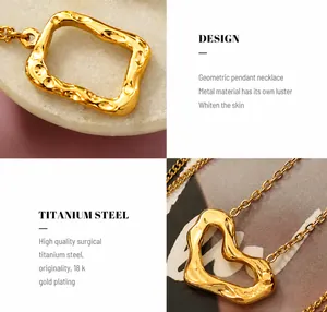 Macro detail of geometric heart pendant in 18K gold plated titanium steel with textured finish