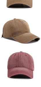Detail of washed cotton baseball caps in brown and maroon colors with vintage stitching
