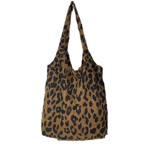 Leopard print canvas tote bag with textured jacquard finish for a chic everyday look