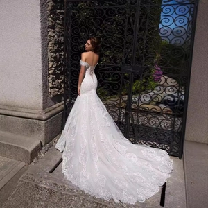 Elegant off-the-shoulder mermaid wedding dress with lace embroidery and long round train