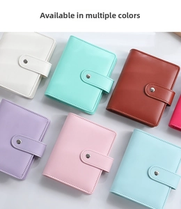 Close-up of colorful A5/A6 PU leather notebooks with metal button closure in varied tones