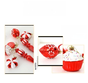 Detail view of red and white Christmas ornaments in star, cupcake, and cone shapes