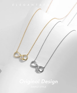 Detail of 925 sterling silver infinity heart necklaces in gold and silver finishes