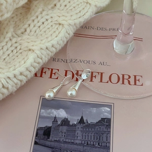 Elegant 925 sterling silver pearl drop earrings in a French minimalist lifestyle setting