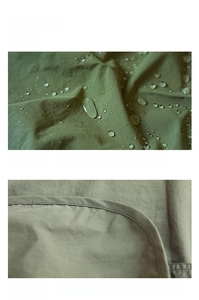 Detailed view of olive green waterproof apron fabric with water droplets and neat stitching