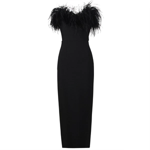 Detail of elegant black tube dress featuring plush feather trim along the neckline
