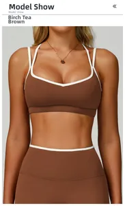 Front view of birch brown sports bra with white trim and crisscross back design