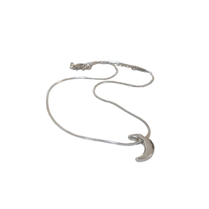 Minimalist silver moon pendant choker necklace with a sleek metallic finish on white background
