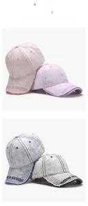 Close-up of four distressed washed cotton baseball caps with embroidered lettering detail