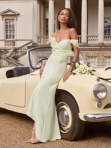 Elegant mint green off-shoulder slim fit maxi dress with floral detail by vintage car