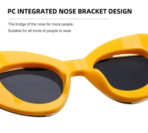 Detail showing the PC integrated nose bracket design of yellow cat eye sunglasses