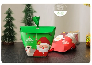 Close-up of festive Christmas gift boxes with Santa and reindeer illustrations