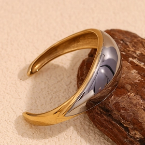 Minimalist two-tone 18K gold plated stainless steel open bangle with sleek finish