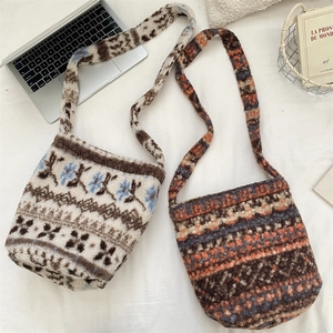 Overview of two faux lamb wool plush shoulder bags with floral ethnic patterns