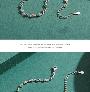 Detail of S925 silver bracelet with colorful round gems and lobster clasp fastening