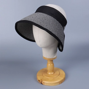 Detailed view of the tight woven texture and gray-black brim of a summer sun visor hat