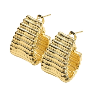 Polished gold textured C-shaped hoop earrings with a metallic embossed stripe finish